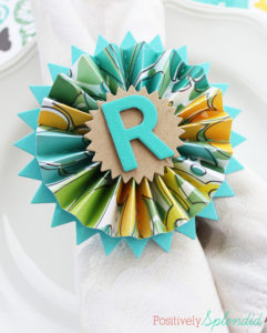 Pretty paper medallion napkin rings made with shower curtain rings. So smart!