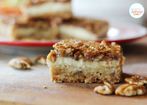 Pecan Cheesecake Squares Recipe at Positively Splendid - A layer of shortbread, a layer of cheesecake, and a layer of pecan pie in every bite. YUM!