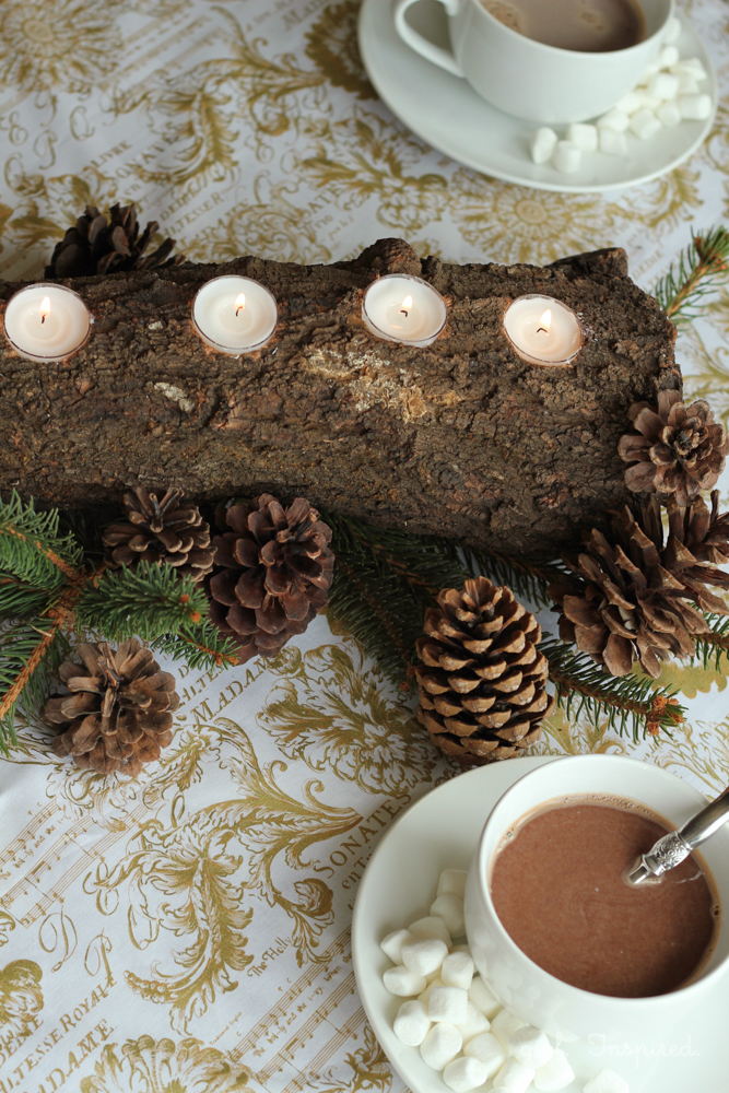 This rustic and chic tealight log centerpiece would be perfect on a holiday table!