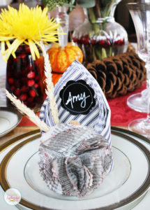 This Thanksgiving table setting at Positively Splendid features creative napkins that double as place cards. Such a great idea!