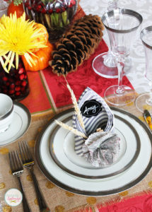 This Thanksgiving table setting at Positively Splendid features creative napkins that double as place cards. Such a great idea!