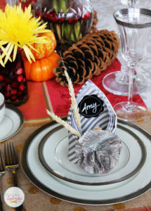 This Thanksgiving table setting at Positively Splendid features creative napkins that double as place cards. Such a great idea!