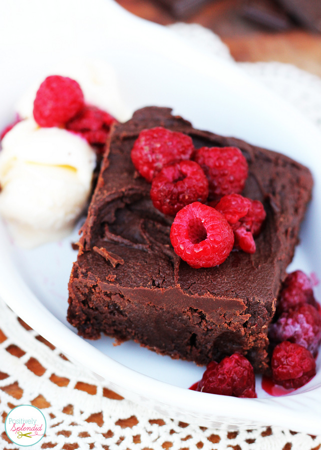 Decadent fudge brownie sundaes with ganache and raspberries