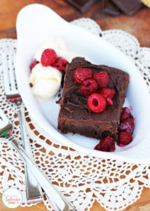 Decadent fudge brownie sundaes with ganache and raspberries