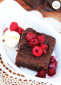 Decadent fudge brownie sundaes with ganache and raspberries