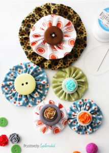 Fabric yo-yo's are a great way to use fabric scraps! Free templates with tutorial at Positively Splendid.