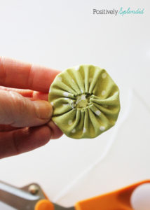 Fabric yo-yo's are a great way to use fabric scraps! Free templates with tutorial at Positively Splendid.