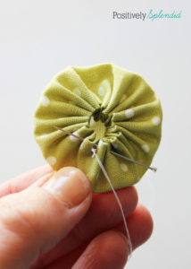 Fabric yo-yo's are a great way to use fabric scraps! Free templates with tutorial at Positively Splendid.