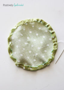 Fabric yo-yo's are a great way to use fabric scraps! Free templates with tutorial at Positively Splendid.