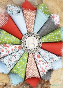 This rolled paper wreath is so pretty, and such a great way to use pretty patterned papers!