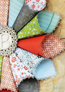 This rolled paper wreath is so pretty, and such a great way to use pretty patterned papers!