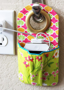Hanging phone charging station sewing pattern and tutorial. This is such a great idea to keep cords contained!