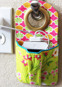 Hanging phone charging station sewing pattern and tutorial. This is such a great idea to keep cords contained!