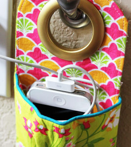 Hanging phone charging station sewing pattern and tutorial. This is such a great idea to keep cords contained!