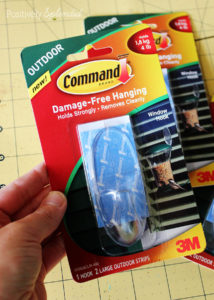 Command hooks are perfect for hanging seasonal decorations in outdoor spaces!