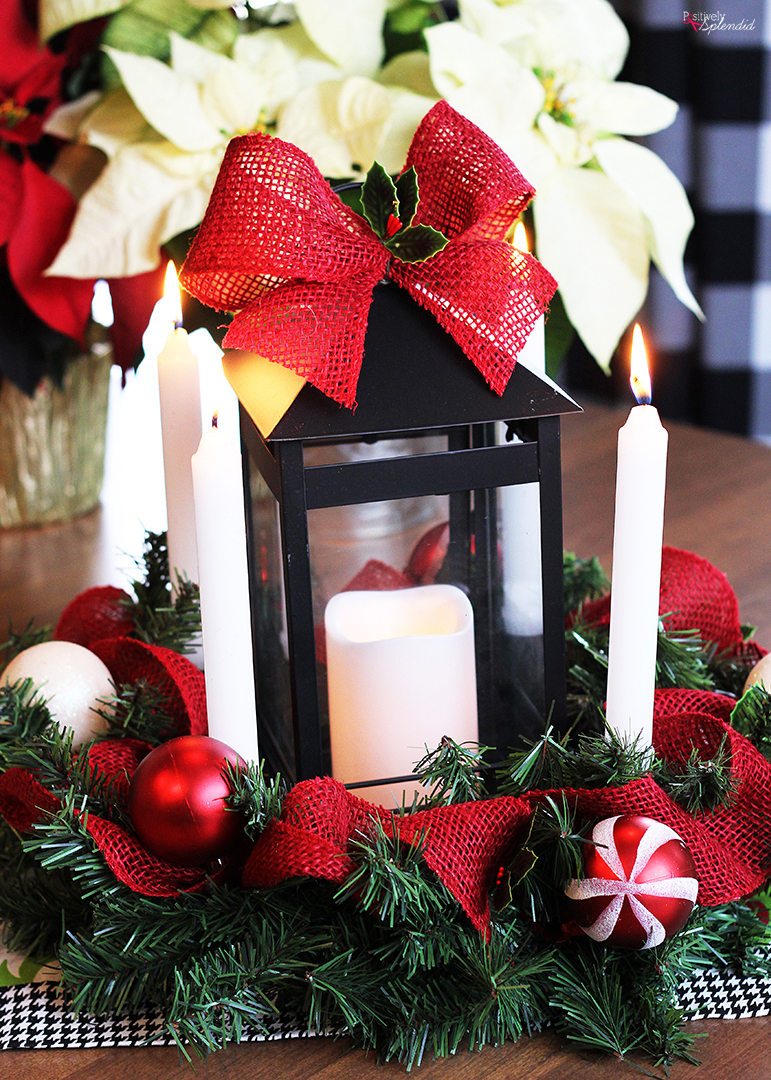 Festive Christmas centerpieces arrangement with candles, ornaments, and greenery