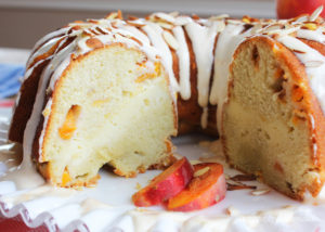 Fresh Peaches and Cream Cake. Moist cake filled with chopped fresh peaches and a ribbon of cream cheese filling, and topped off with peach-cream cheese frosting. Delicious!