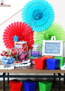 Such a fun kids' birthday party idea! Set up a candy buffet so kids can fill up a box to take home after the party. #LetsBirthday