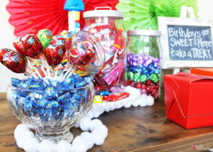 Such a fun kids' birthday party idea! Set up a candy buffet so kids can fill up a box to take home after the party. #LetsBirthday