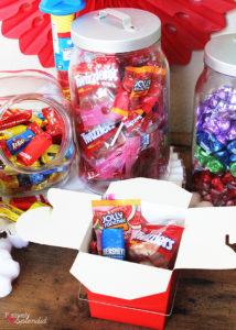 Such a fun kids' birthday party idea! Set up a candy buffet so kids can fill up a box to take home after the party. #LetsBirthday
