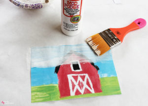 Create a custom photo transfer canvas with your child's artwork using Mod Podge Photo Transfer Medium! So smart! #PlaidCreators