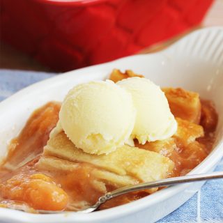 This Old-Fashioned Peach Cobbler Recipe is the BEST, with two layers of crust and a delicious fresh peach filling!