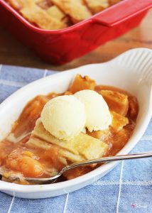 This Old-Fashioned Peach Cobbler Recipe is the BEST, with two layers of crust and a delicious fresh peach filling!