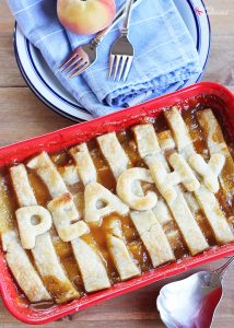 This Old-Fashioned Peach Cobbler Recipe is the BEST, with two layers of crust and a delicious fresh peach filling!