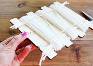Bucilla RyaTie is the easiest way to make pom-poms for home decor projects!
