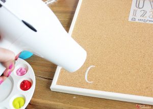 Stenciled Bulletin Board - Turn an inexpensive IKEA bulletin board into fun DIY decor for organizing any space!