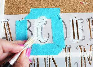Stenciled Bulletin Board - Turn an inexpensive IKEA bulletin board into fun DIY decor for organizing any space!