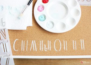 Stenciled Bulletin Board - Turn an inexpensive IKEA bulletin board into fun DIY decor for organizing any space!