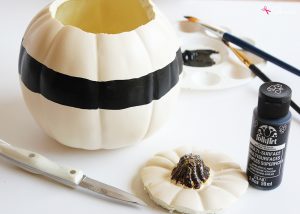 DIY Pumpkin Centerpiece - Made with pretty wood flowers and an artificial pumpkin from Michaels #makeitwithmichaels #michaelsmakers