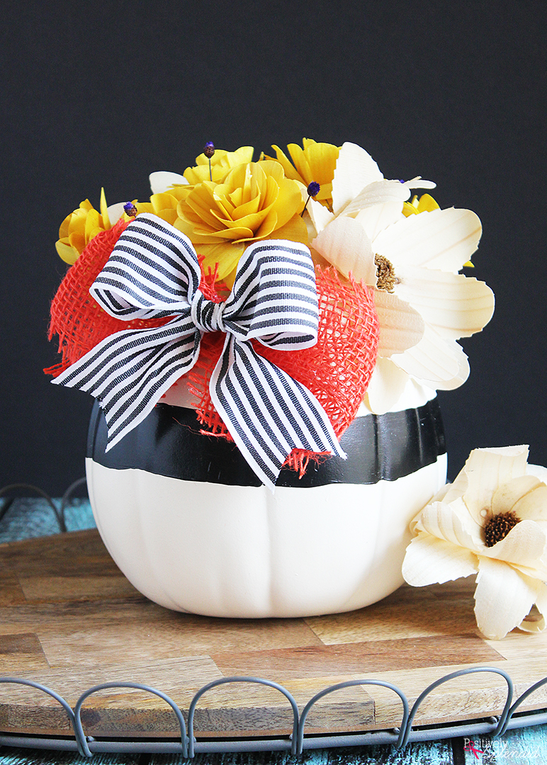 DIY Pumpkin Centerpiece - Made with pretty wood flowers and an artificial pumpkin from Michaels #makeitwithmichaels #michaelsmakers
