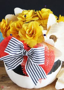 DIY Pumpkin Centerpiece - Made with pretty wood flowers and an artificial pumpkin from Michaels #makeitwithmichaels #michaelsmakers