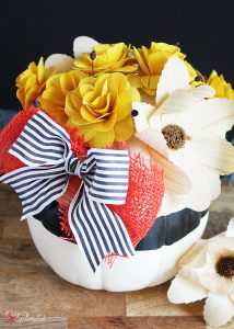 DIY Pumpkin Centerpiece - Made with pretty wood flowers and an artificial pumpkin from Michaels #makeitwithmichaels #michaelsmakers
