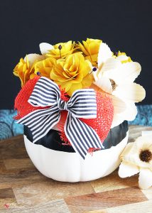 DIY Pumpkin Centerpiece - Made with pretty wood flowers and an artificial pumpkin from Michaels #makeitwithmichaels #michaelsmakers