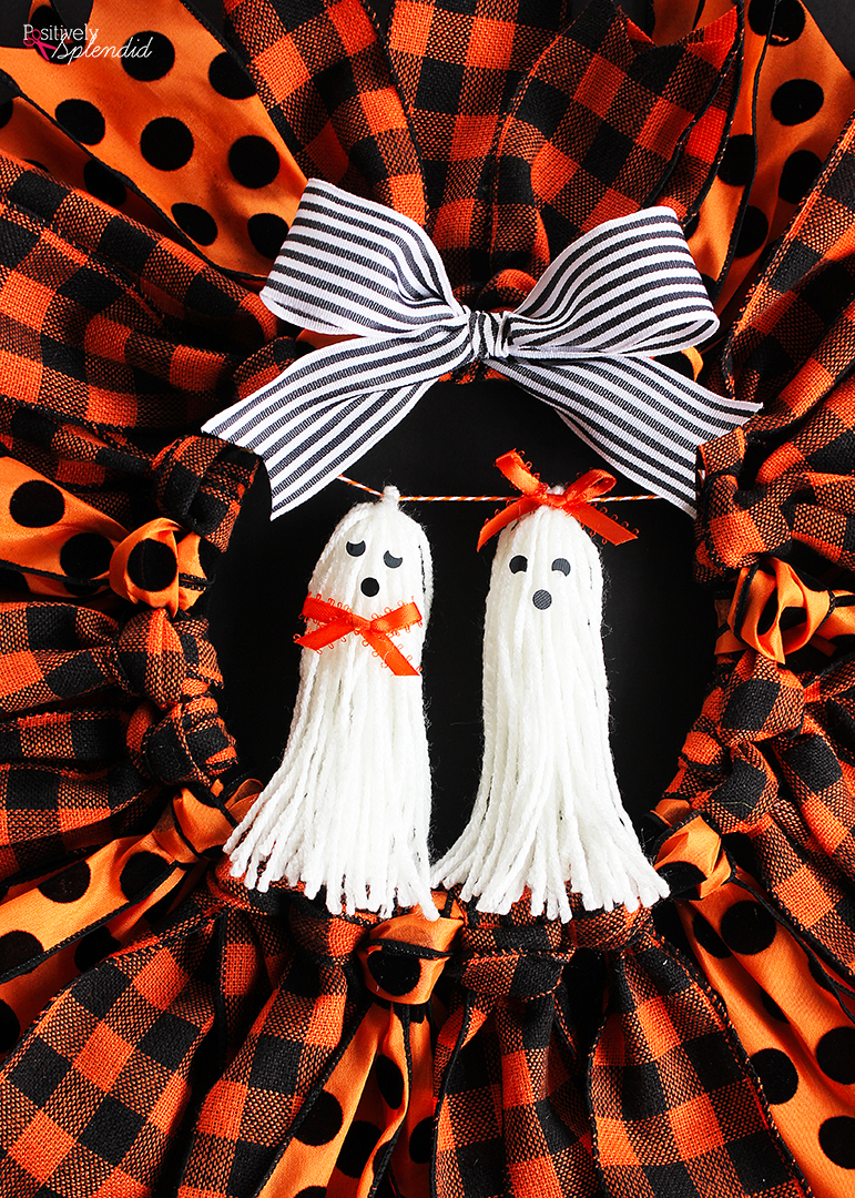 Halloween Ribbon Wreath -- So easy to make with an embroidery hoop, and these ghost tassel embellishments are adorable!