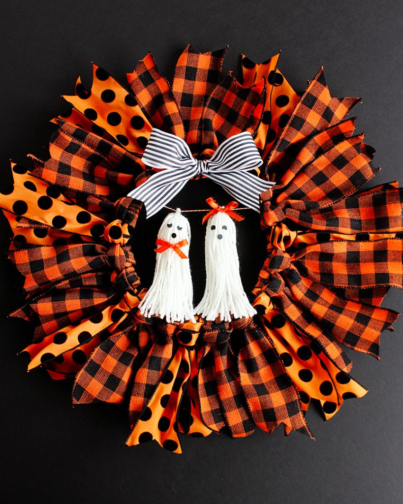 Halloween Ribbon Wreath -- So easy to make with an embroidery hoop, and these ghost tassel embellishments are adorable!