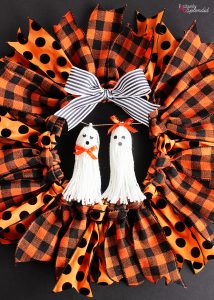 Halloween Ribbon Wreath -- So easy to make with an embroidery hoop, and these ghost tassel embellishments are adorable!