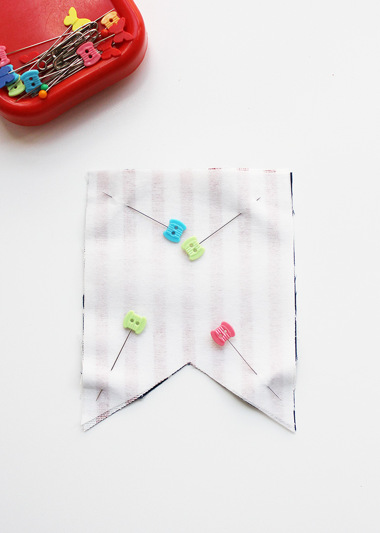 Pin fabric bunting pieces together