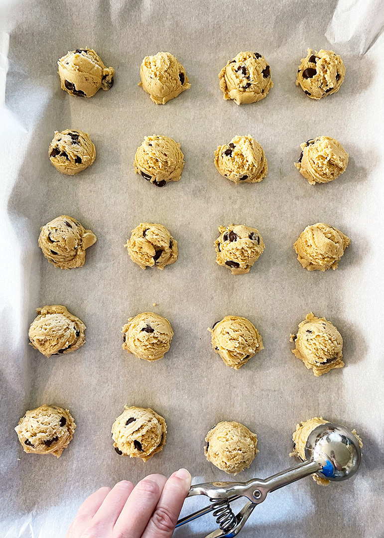 Scoop Batter on Parchment Lined Cookie Sheet